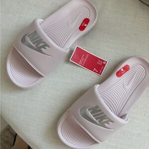 Nike Women's Light Pink Slide Sandals